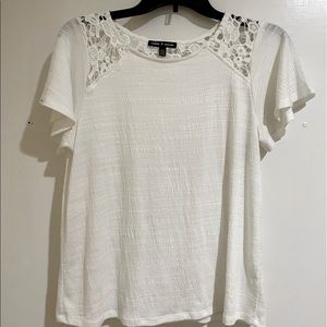 Cute white top! Perfect for summer and spring! Gently used. Size Medium.